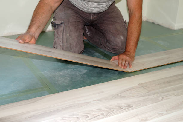 istock a man is installing a laminate on the floor close-up 1335890215