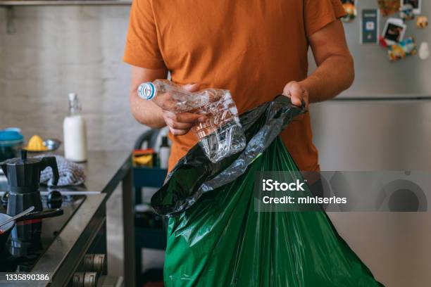 Cooking At Home Handsome Man With Garbage Bag Stock Photo - Download Image Now - Recycling, Garbage, Plastic