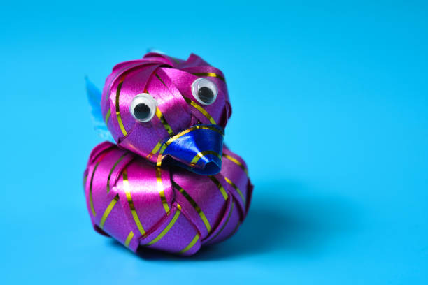 Purple hand-made duck ribbon as a gift for Christmas and New Year, wedding and birthday.