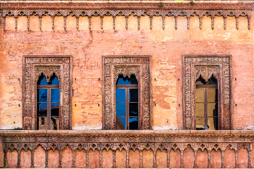 Architectural detail of the Casa del Mercante (Merchant's House), an historic building dating to the middle of the 15th century overlooking Piazza delle Erbe, in the core of the old town of Mantua.