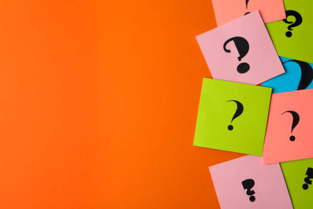 istock Paper cards with question marks on orange background, flat lay. Space for text 1335894649