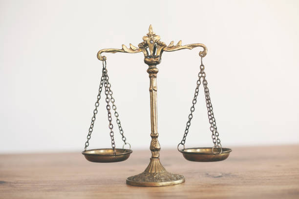 istock white background scales of justice,justice concept 1335895304