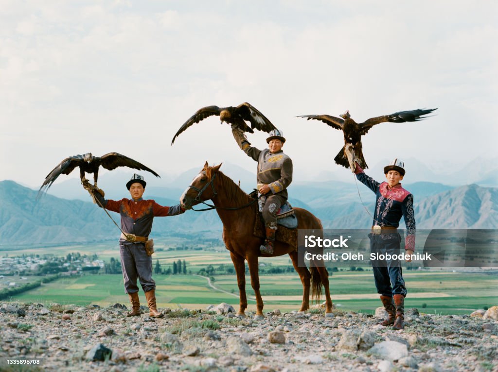 Eagle hunter on horse in steppe in Kyrgyzstan Eagle hunter on horse in steppe  in Kyrgyzstan Archival Stock Photo