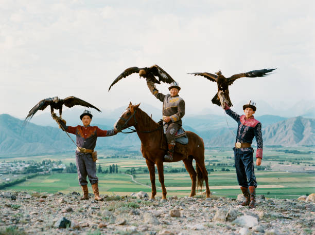 Eagle hunter on horse in steppe in Kyrgyzstan Eagle hunter on horse in steppe  in Kyrgyzstan kyrgyzstan photos stock pictures, royalty-free photos & images