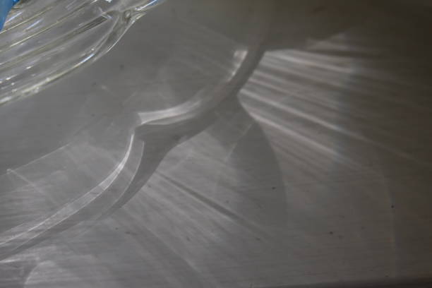 Extreme close-up of water about to overflow from a drinking glass.\nSurface Tension