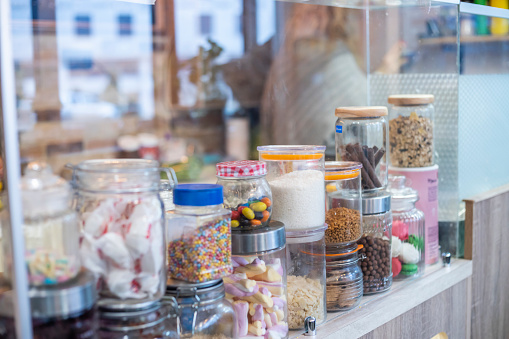 showcase of jars filled with candy. Small business. Pancakes shop. candy