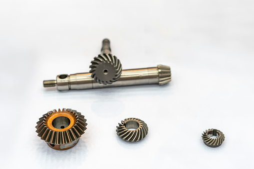 mini metal straight bevel gear and spiral bevel gear for industrial on white table