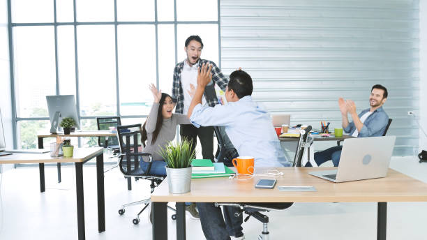 istock Office teamwork celebration working happiness Happy business people dance expression together at office after job done complete in meeting room. Diversity people happy moment dance together in company 1335902518