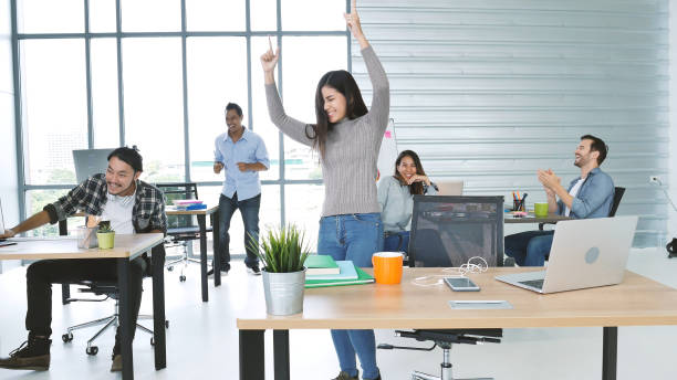 istock Office teamwork celebration working happiness Happy business people dance expression together at office after job done complete in meeting room. Diversity people happy moment dance together in company 1335902521