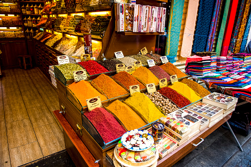 Several photos of market stalls in the Grand Bazaar of Istanbul, Turkey.  Spices, Turkish delight, and dried fruits are all on display.