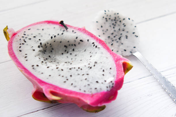 istock slice of dragon fruit on a chopping board. 1335903966