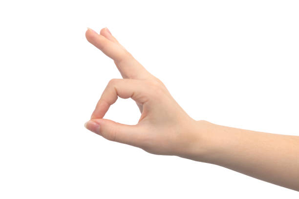 istock Hand gesture ok, isolated on a white background, young female hand close-up 1335904405