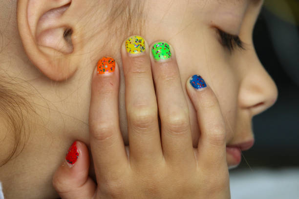 istock Six-year-old girl with painted nails 1335905036