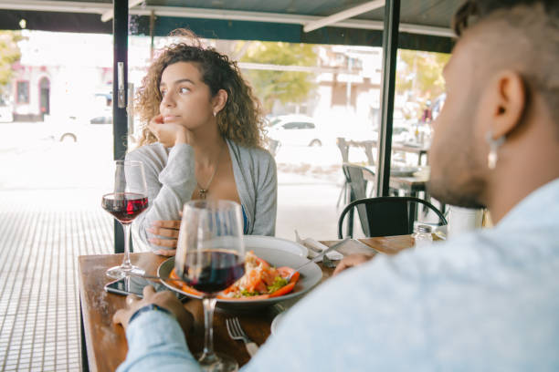 istock Woman getting bored at a date at a restaurant. 1335905556