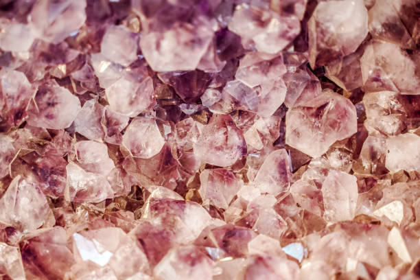 istock Mineral quartz background. Pink mineral cutaway with stone texture and pattern 1335910413