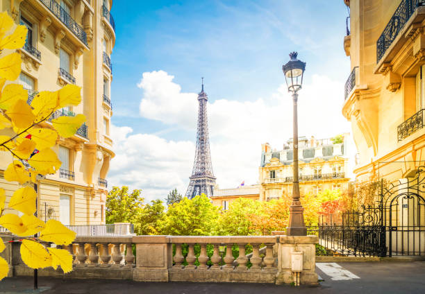 istock eiffel tour and Paris street 1335913473