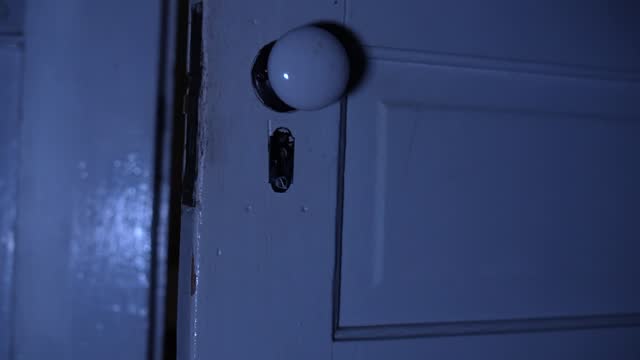 Rattling doorknob moving at night