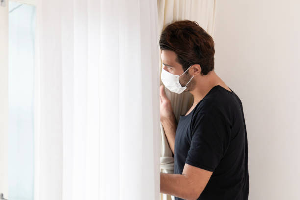 istock Male suffering from depression and anxiety feeling overwhelmed and helpless during coronavirus (Covid-19) outbreak. 1335916521