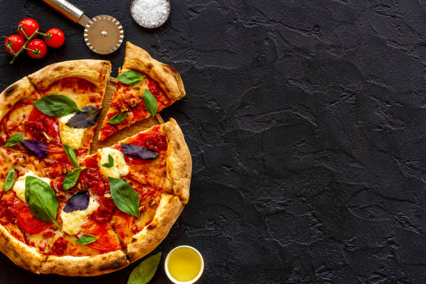 istock Delicious pizza with cheese tomatoes sauce and basil 1335919718