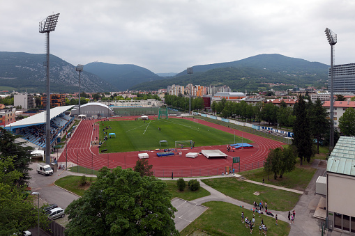 Nova Gorica, Slovenia - June 02, 2012: View from the roof of a surrounding skyscraper of the Nova Gorica Sport Stadium during a national sport meeting.