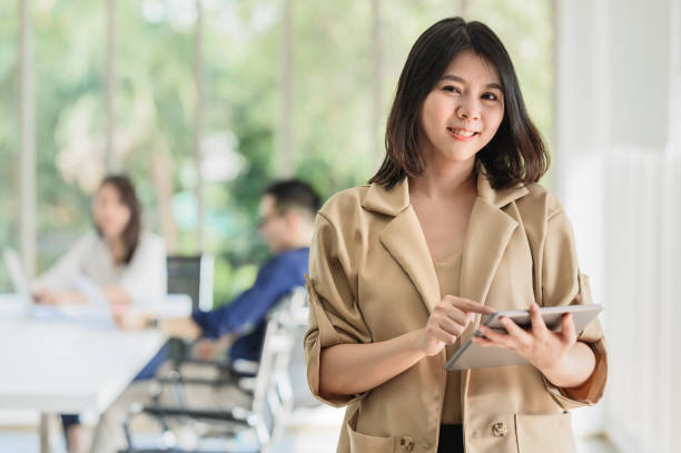 istock business woman using digital tablet in meeting room 1335926176