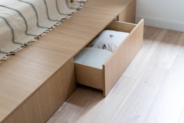 Bedroom interior, wooden bed at modern room. Bedroom interior, wooden bed at modern room. Furniture design with open wood drawer, white pillow decoration object in box. Brown comfortable storage for bedding cushion. bed decoration stock pictures, royalty-free photos & images