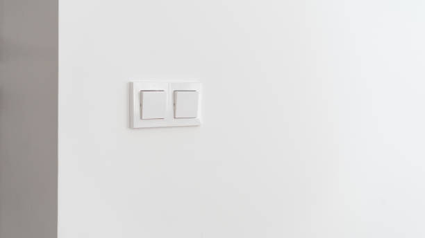 istock Switch light at wall, closeup to interior details. 1335927339