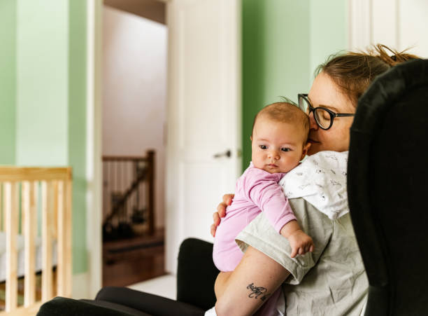 istock Young mother with baby at home 1335928392