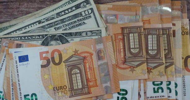 istock Detail of euro notes against dollars 1335928521