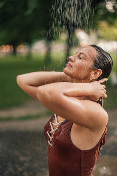 istock Relaxing under shower on a hot summer day. 1335928613