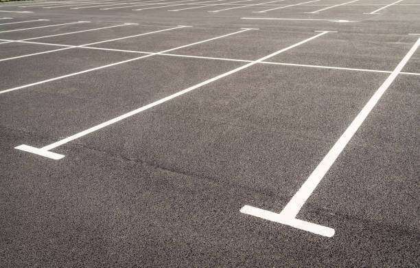 istock Car park spaces on fresh asphalt 1335929179
