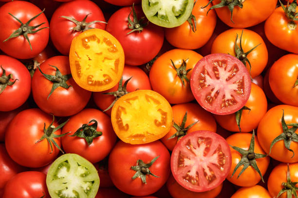 istock Ripe red and yellow tomatoes. Food background. Top view. 1335930099