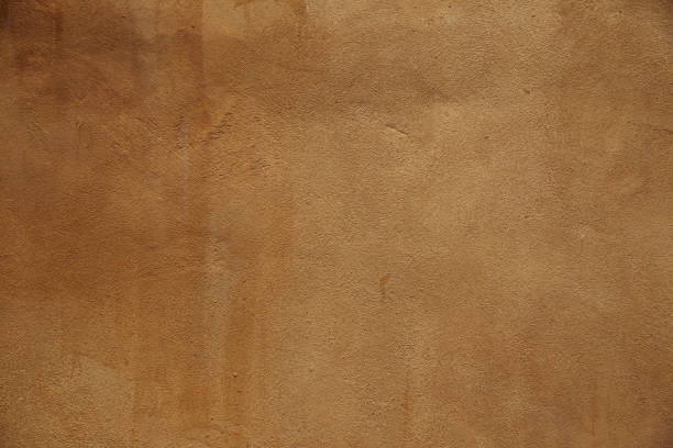istock Yellow natural stone sand texture. Beige background, facade 1335932578