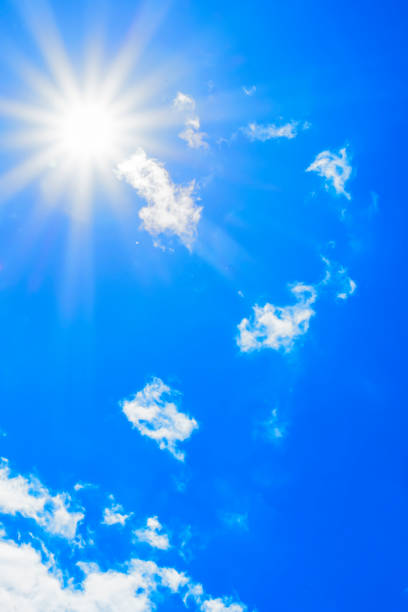 istock Bright sun with beautiful beams in the sky with light clouds 1335932716