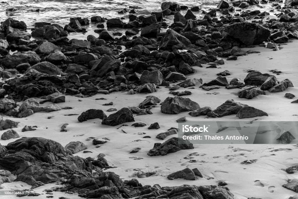 Rocks in the sands of Ondina beach on a sunny day. Rocks in the sands of Ondina beach on a sunny day. Salvador, Bahia, Brazil. Travel Stock Photo