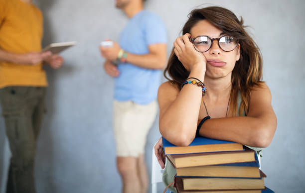 istock Eager student overwhelmed by studying and reading books 1335937068