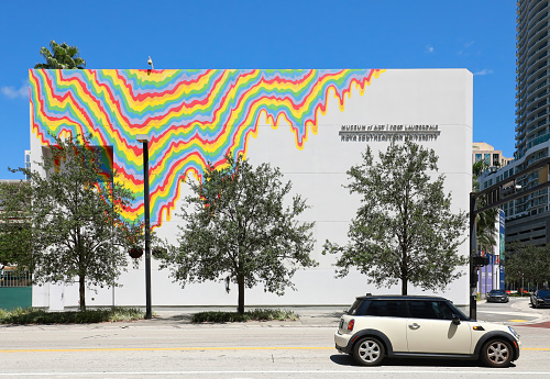 Fort Lauderdale, Florida, USA - August 8, 2021:  A car waits by the light by the Nova Southeastern University (NSU) Museum of Art building.