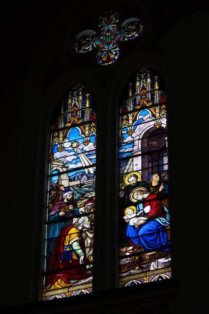 istock Colorful stained glass windows from a Catholic church. 1335937912