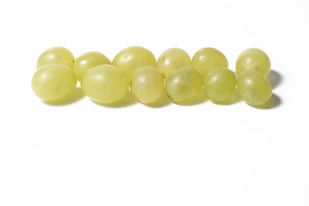 Twelve grapes on white background stock photo