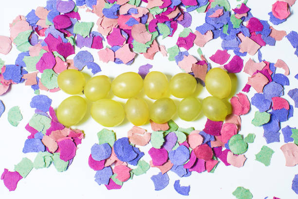 Twelve grapes and confetti for New Year's holiday stock photo