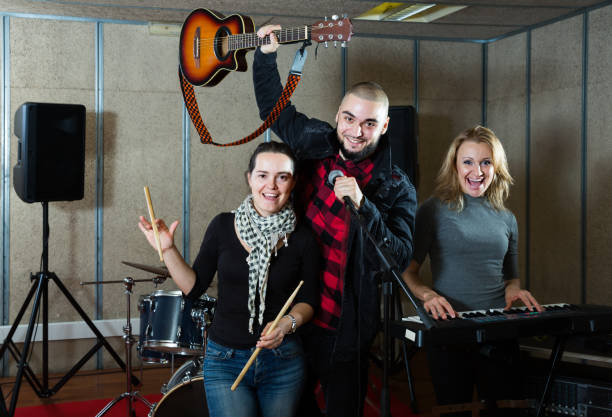 istock Expressive guitarist, drummer and keyboardist 1335941020