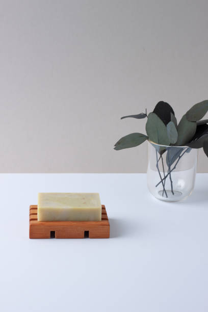 istock Soap with eucalyptus on grey natural background. Close up, copy space. 1335944361