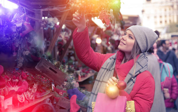 istock Girl shopping Christmas decorations 1335953103