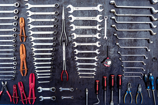 Set of wrenches on grey background.