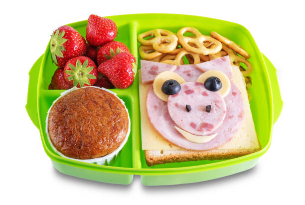 istock School healthy lunches with funny faces in a container on a white isolated background 1335958452