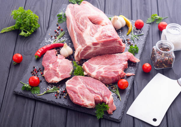 istock Raw pork neck with spices and herbs 1335960231