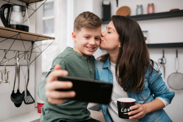 istock Caucasian mother bonding with her son at home 1335961112