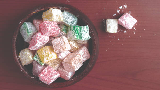 istock Colored turkish delight on wooden background 1335963889