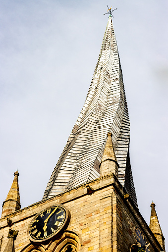This church, the largest in Derbyshire, was built in the 14th century and the famous 'crooked spire' was added in about 1362. Although it was at first thought the spire was twisted owing to the lack of skilled craftsmen after the recent Black Death or Bubonic plague, it's now thought the twist is the result of the lead which covers the spire. Sun shining on the south side in the day causes that side to heat up and expand at a faster rate than the north side, leading to unbalanced expansion and contraction.