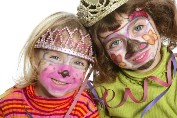istock party little two sisters with painted happy face 1335968806